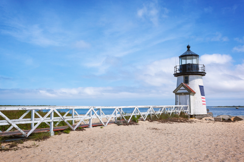 The Brant Point Lighthouse in Nantucket acts a symbol for the island, which is one of the best couples vacations in the US with New England charm