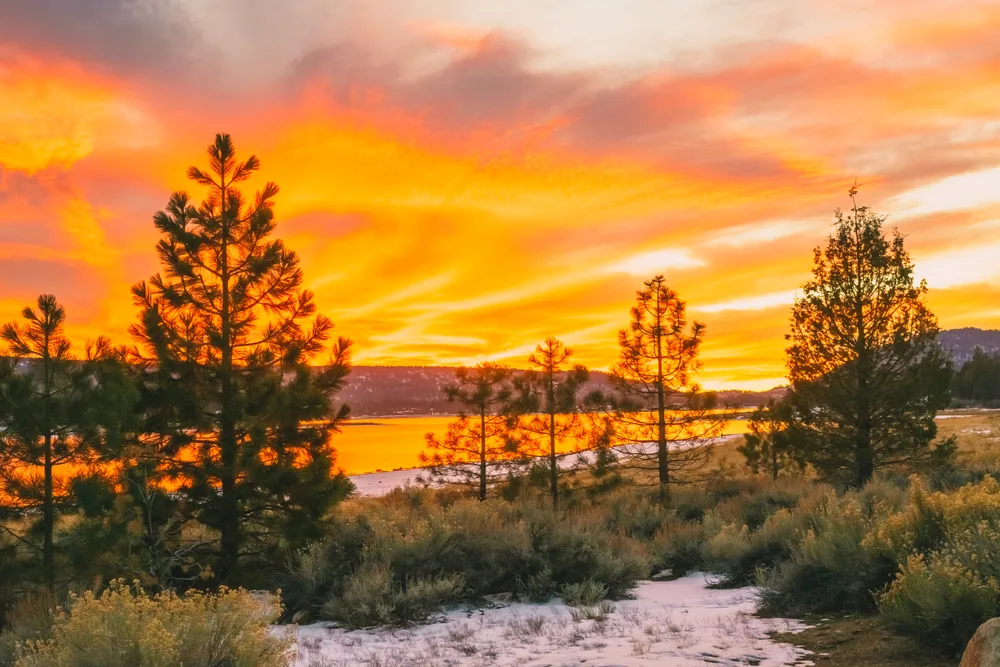 Picturesque dusk view of the lake and shoreline in the winter at Big Bear lake in California