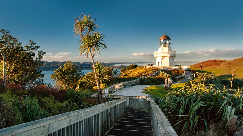 Closeup of the Manukau Heads Lighthouse in Auckland, one of the best places to stay in New Zealand, on a clear day