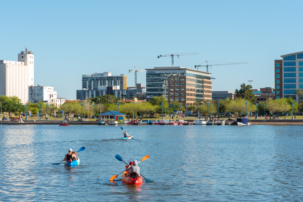 People kayaking on a river in Tempe, one of our top picks for areas when considering where to stay in Phoenix