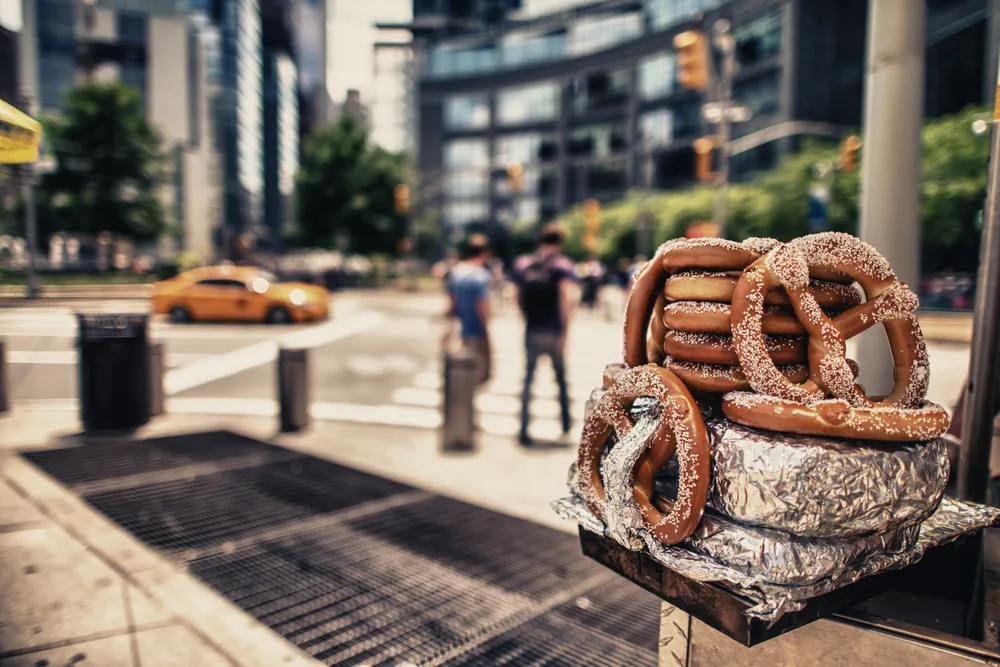 Hotdogs and pretzels from a food vendor cart in Manhattan, NYC which ranks as one of the best East Coast vacation spots to visit