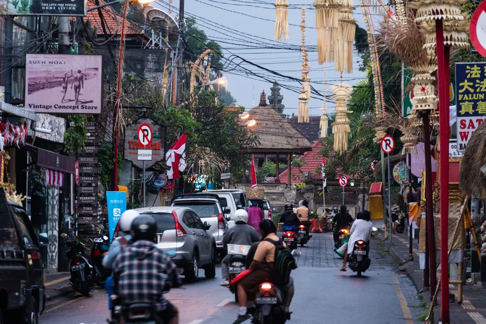 Crazy traffic of scooters in Ubud, as seen in the morning with power lines overhead