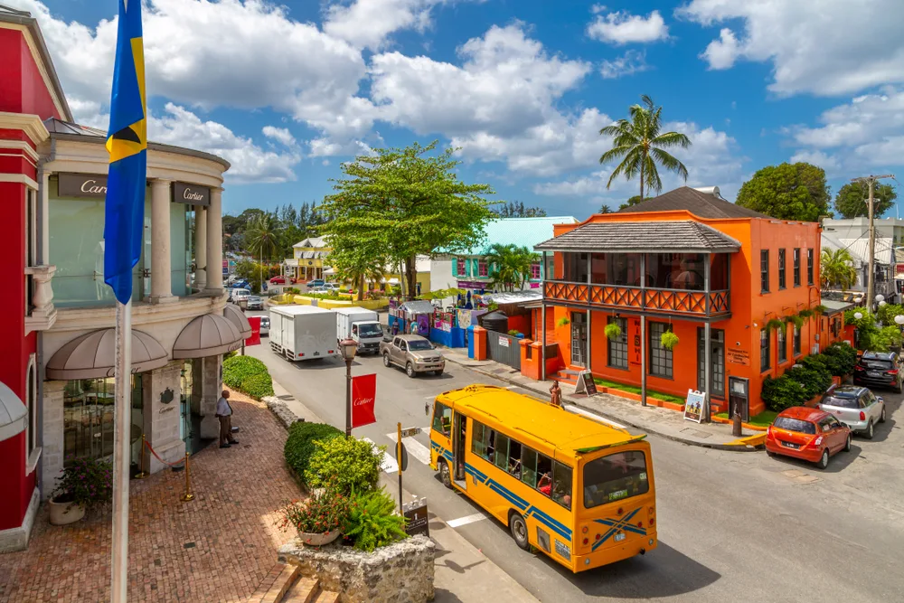 Busses making their way through the city center of Holetown for a guide titled trip to Barbados cost