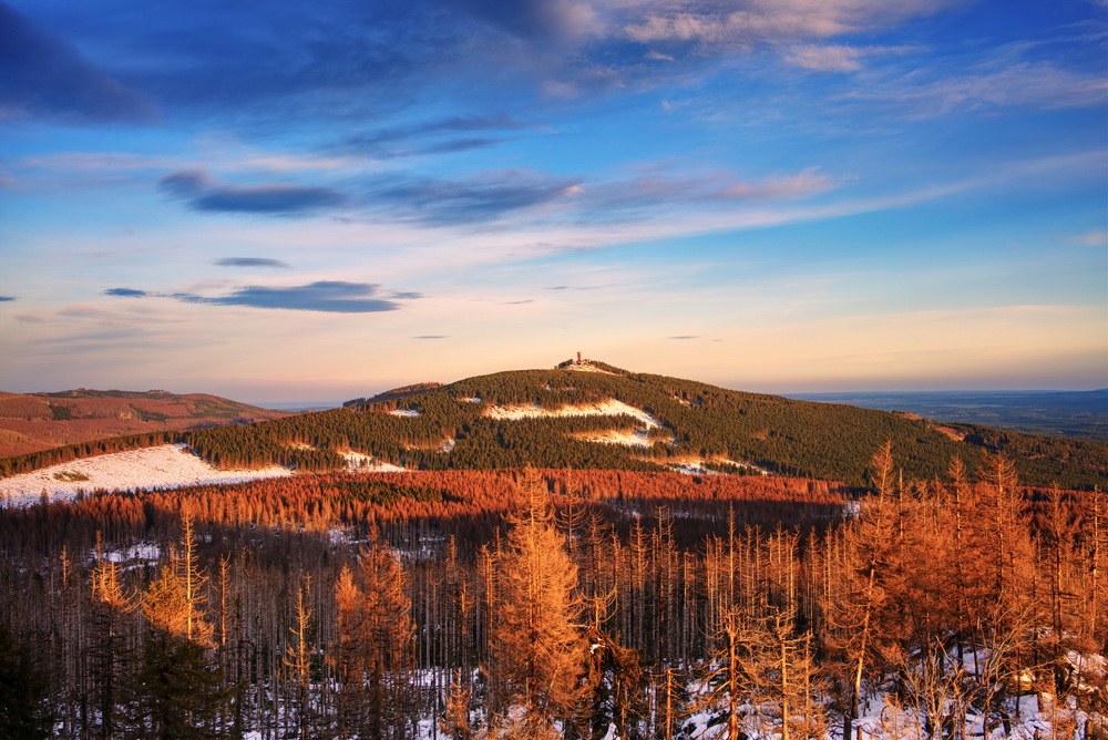 View of Wurmberg mountain in the Harz Mountains range during February with sunset in the sky for a list of the best mountains in Germany