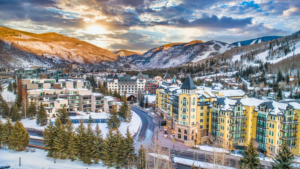 Skyline view of Vail Colorado during winter with snow on the ground for a list of the best destinations for couples vacations in the US