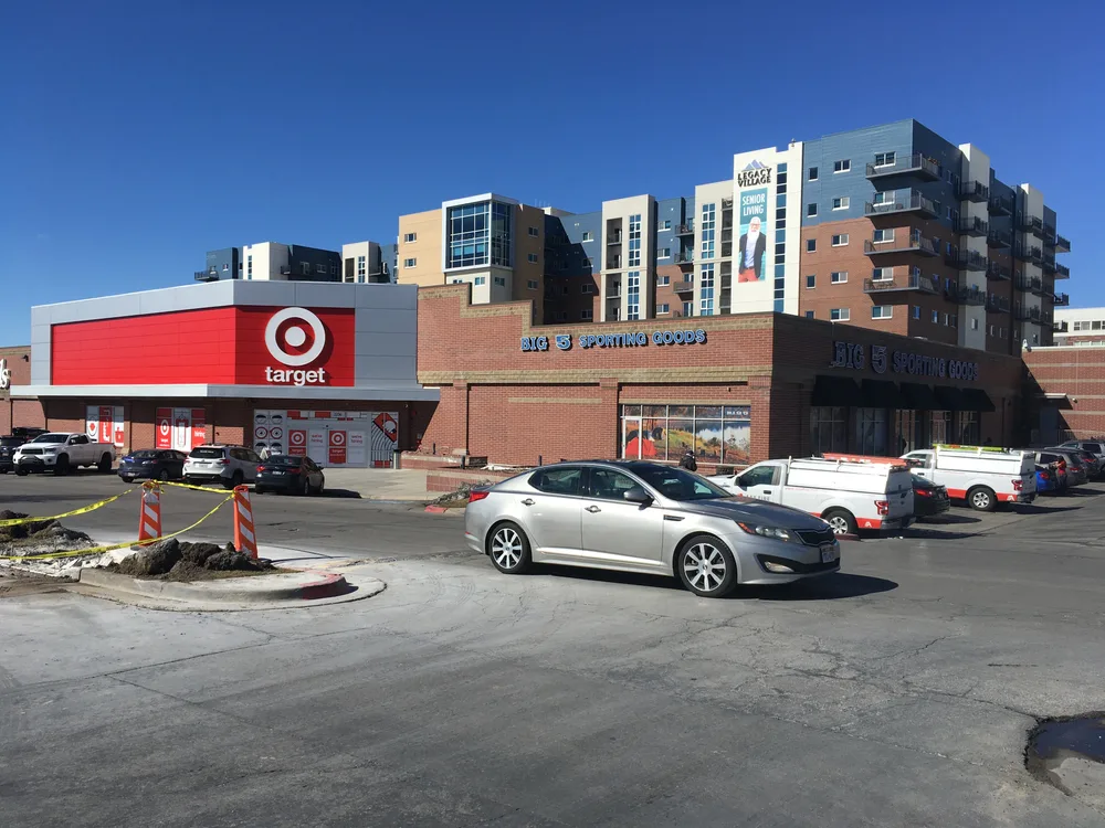 Cars driving by the camera outside of a Target store pictured for a guide to the best places to stay in Salt Lake City