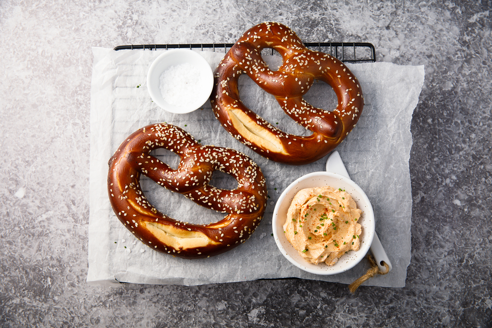 Traditional Laugenbrezel or German soft pretzels served with butter and sprinkled with salt are a contender for the best German food to try