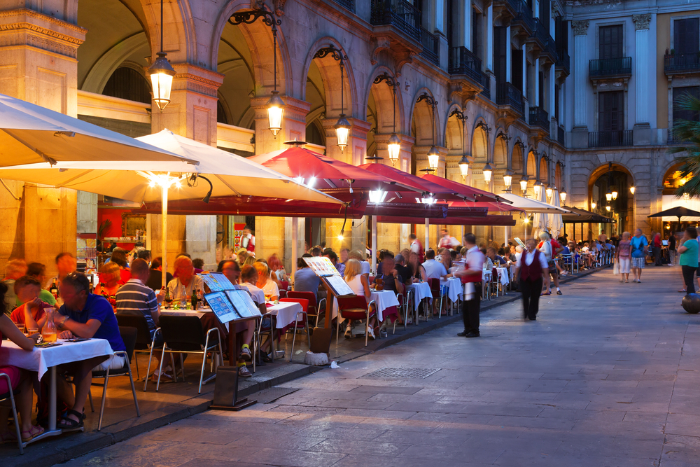 Restaurants pictured at night at Placa Reial in Barcelona