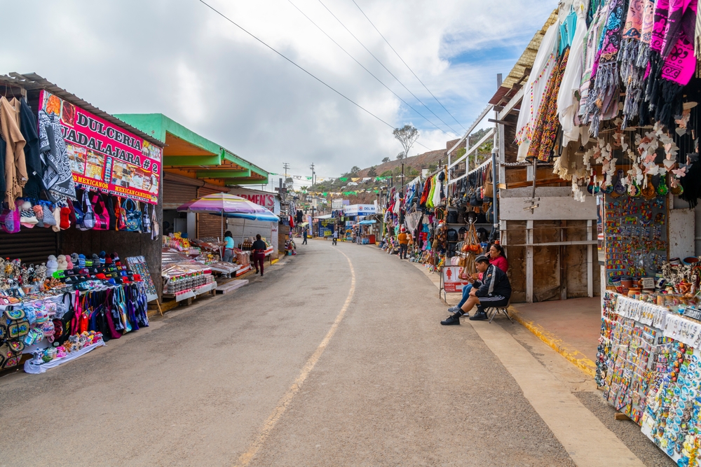 Photo of an open-air market with rows of booths and stalls pictured in Ensenada, one of Baja California's best places to visit