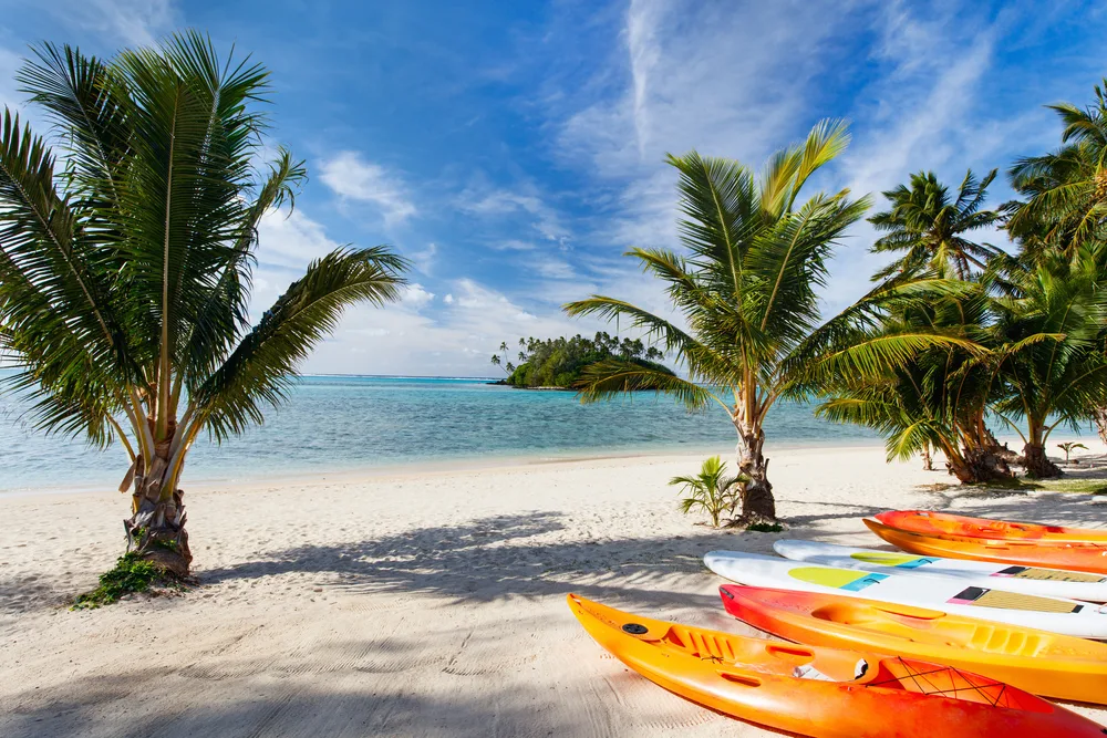 Kayaks on the gorgeous and picturesque Muri Beach on Rarotonga, one of the best options for those considering where to stay in the Cook Islands