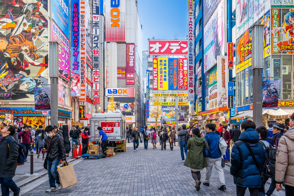Photo of the colorful neon signs in Akihabara, one of the best areas for nightlife in Japan, for a guide titled Trip to Japan Cost