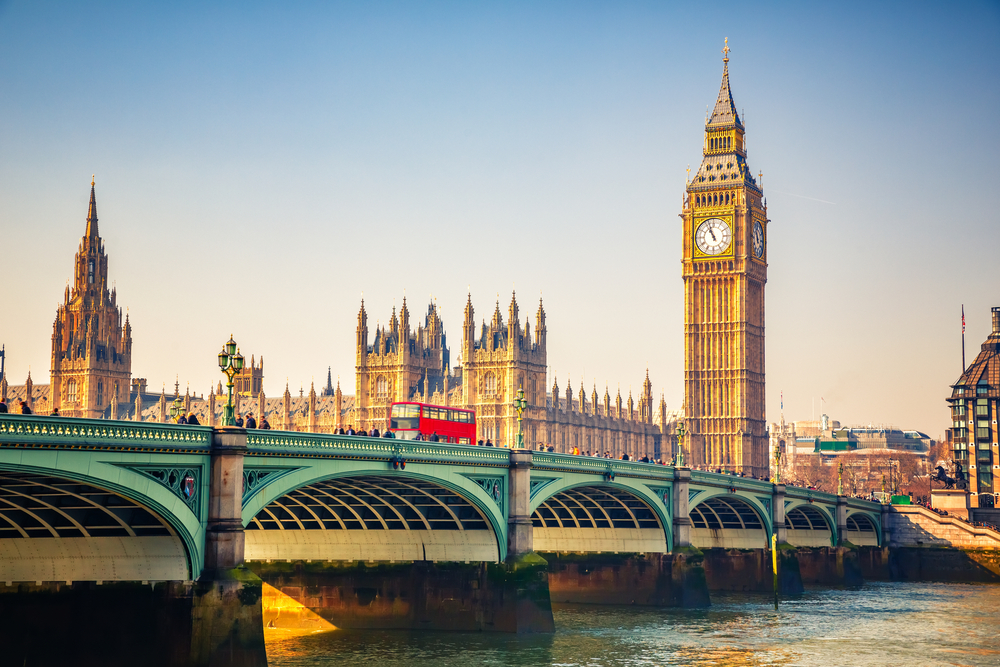 London landmarks Big Ben and Westminster Bridge at sunrise to show one of the best cities in Europe for a visit
