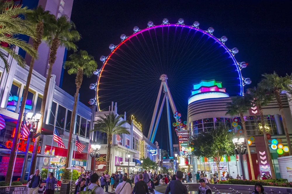 Night photo of the High Roller pictured towering over Vegas for a guide to the average trip to the city cost