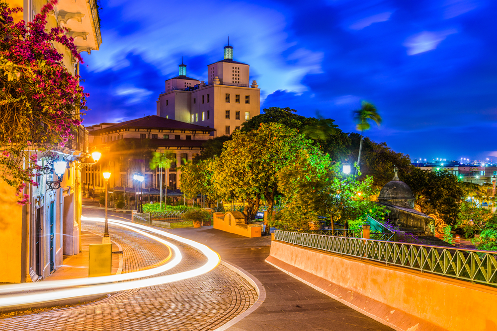 Picturesque night view of the old streets in San Juan pictured for a guide titled the Average Trip to Puerto Rico Cost