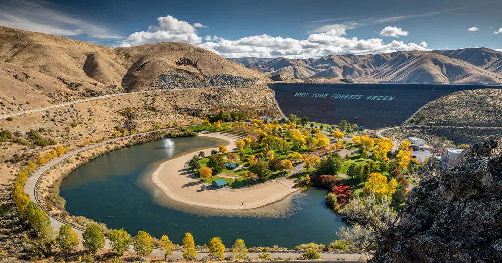 Neat view of the Icon Idaho dam in the fall with a park in the middle