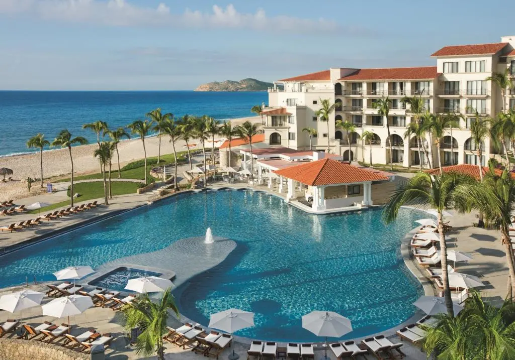 Aerial image of the pool deck at Dreams Los Cabos, one of the best all-inclusive family resorts in Cabo