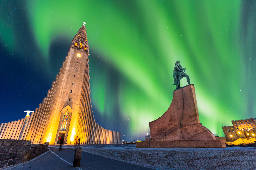 For a piece on whether Iceland is safe to visit, a photo of the Northern Lights over the Hallgrimskirkja Church in Reykjavik