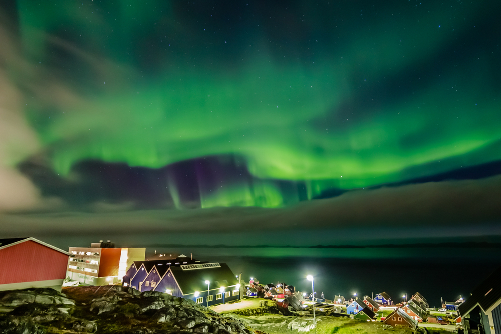 Northern lights pictured over the clouds in Nuuk