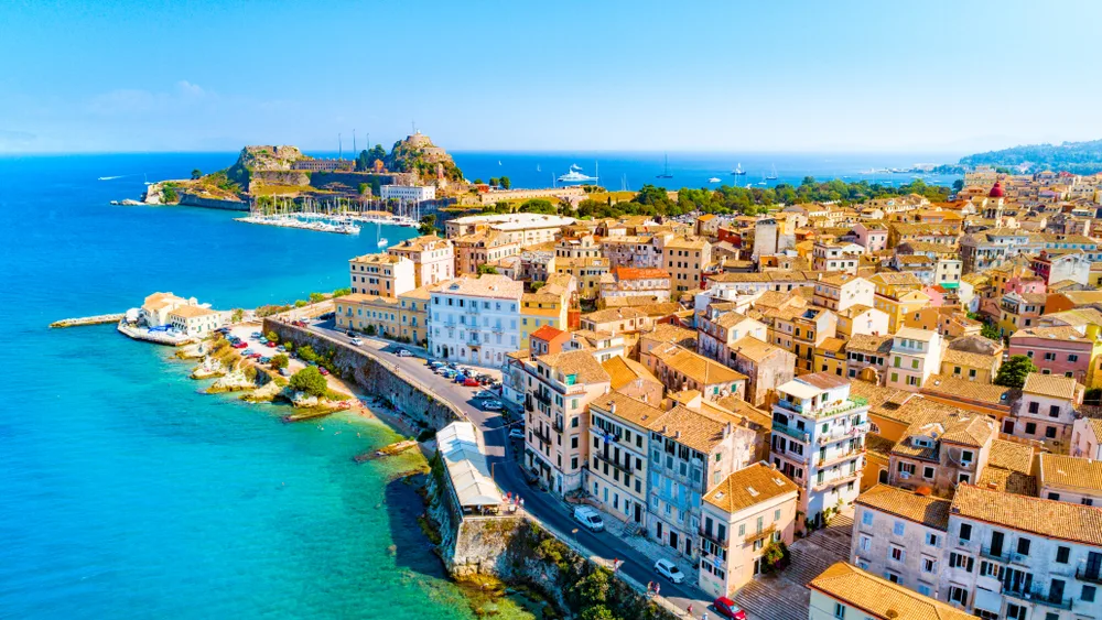 Kerkyra, Corfu aerial view during the daytime with buildings on the shore for a list of the best Greek party islands