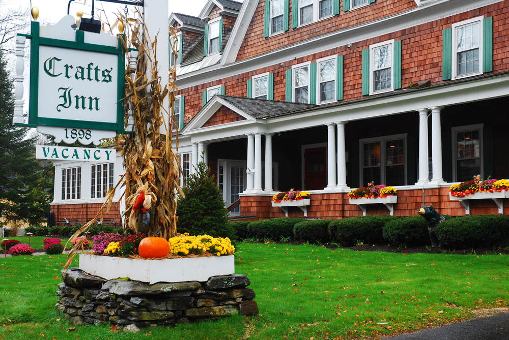 Wilmington, VT Craft's Inn exterior view during fall with decorations up for a comparison between motels, hotels, and inns
