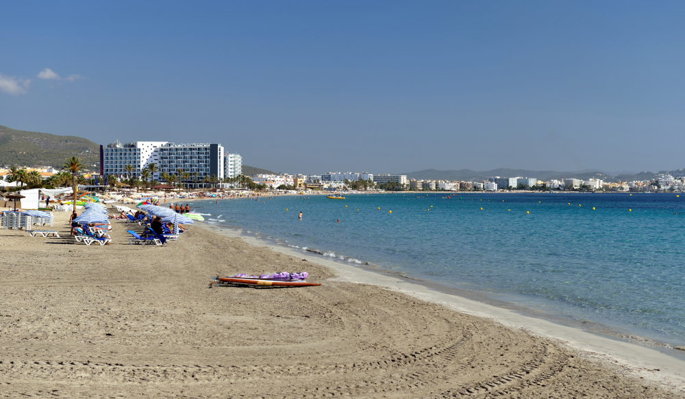 Platja d’en Bossa beach, one of the areas to avoid to stay safe in Ibiza, pictured on a still day with nobody on the beach
