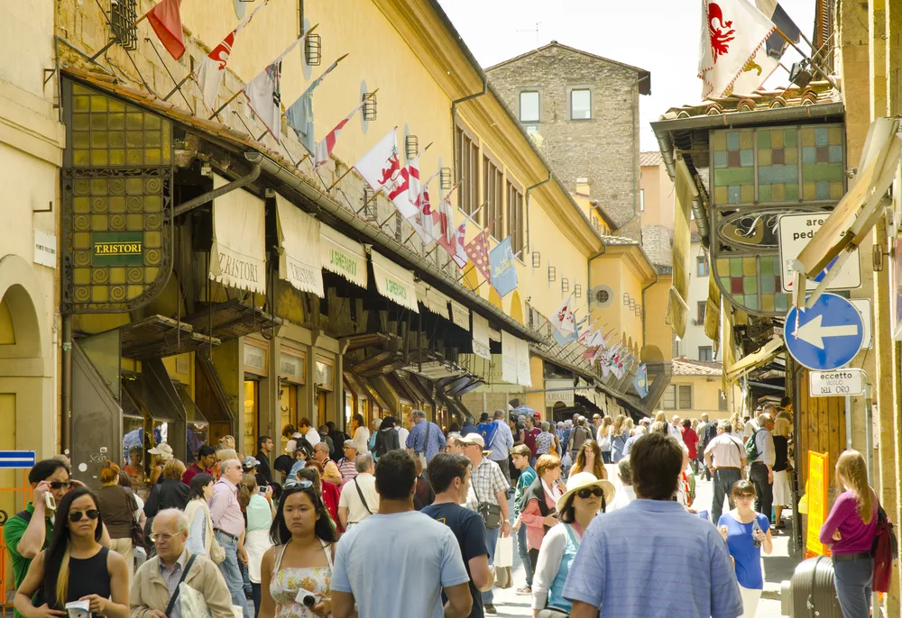 Crowded street in Florence pictured on the Ponte Vecchio, one of the most famous landmarks in the area