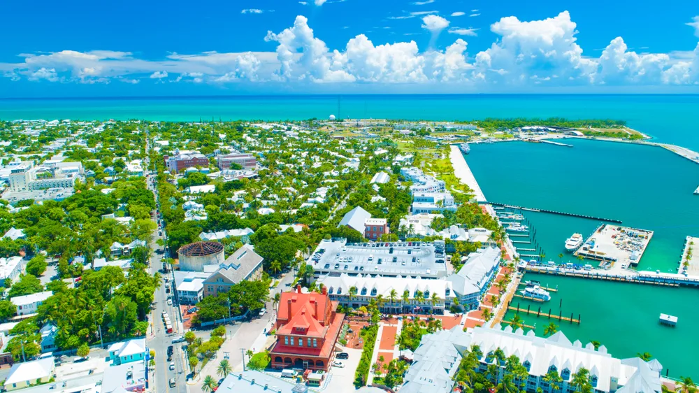 Aerial view of Key West, Florida shoreline with blue skies for a list of the best places to visit in the United States during winter