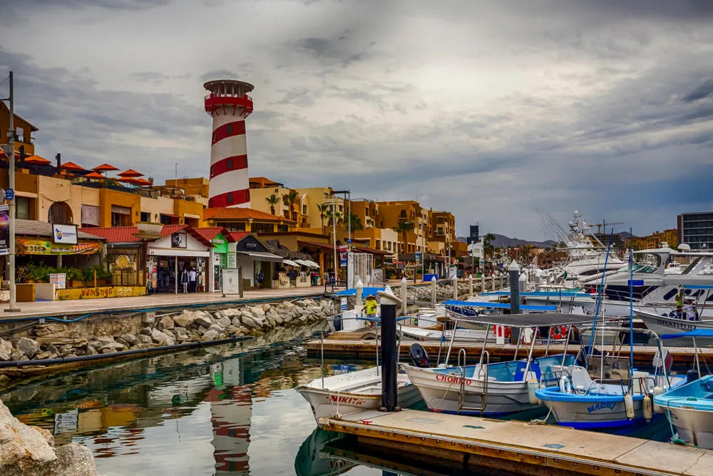 Photo of the marina pictured on an overcast day for a guide titled Where to Stay in Cabo