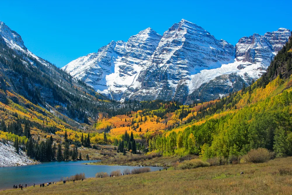 Snow Mountain in Aspen, CO shown with a lake below in a list of the best wedding destinations in the US