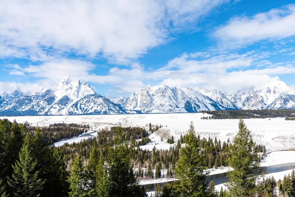 Snake River view with mountains in the distance at Grand Teton National Park in Jackson Hole, Wyoming during winter
