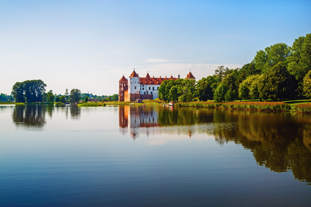 Castle on the shore of the lake for a guide titled where to stay in Belarus