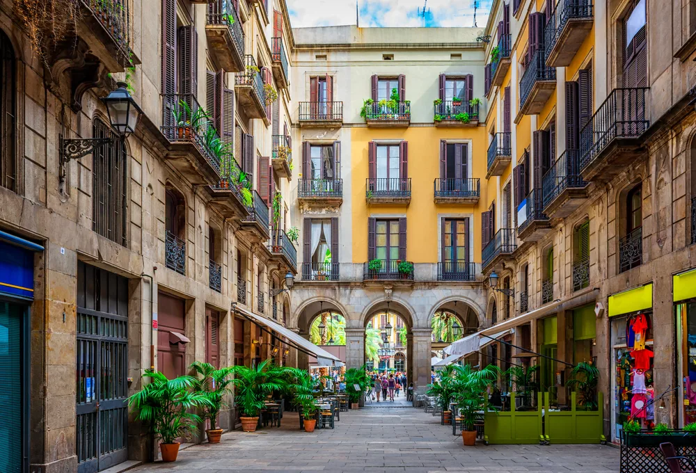 Narrow street in Barcelona for a guide to whether it's safe to visit the city, depicting the cozy architecture found throughout the city