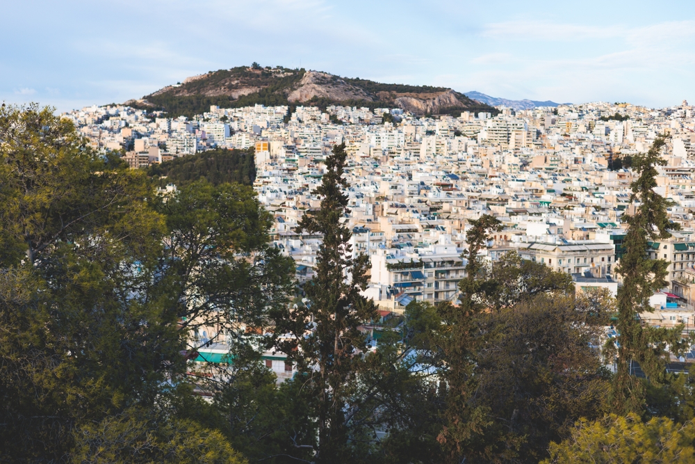 View of the hilltop neighborhood of Exarcheia pictured for a guide on whether it is safe to travel to Athens
