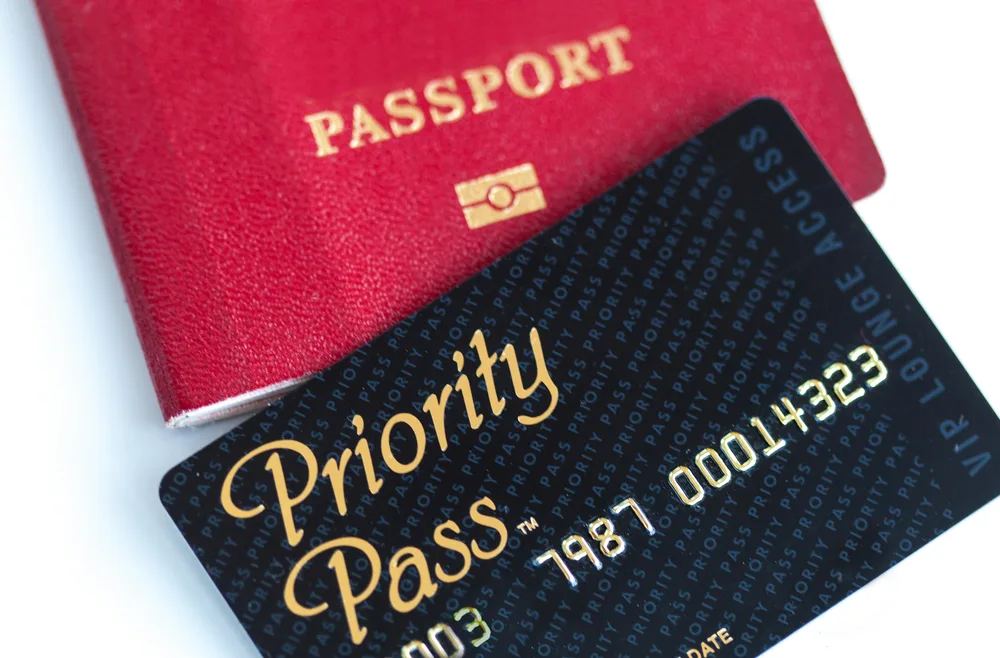 Priority Pass membership card shown over a red passport for a section answering are Priority Pass lounges usually crowded