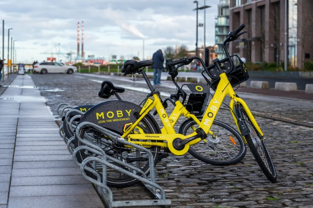 Yellow MOBY bicycle pictured in a bicycle stand in Dublin