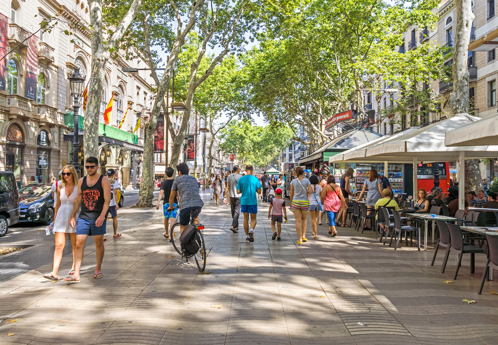 Photo of people walking around La Ramblas, one of the city's busiest areas, for a guide titled Is Barcelona Safe to Visit