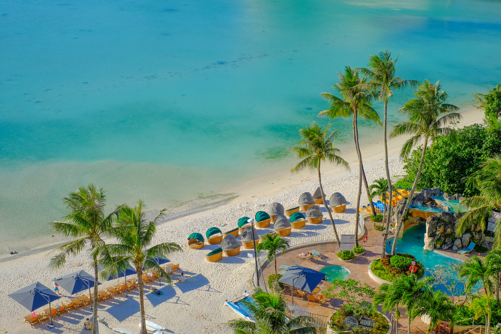 Tumon Bay beach in Guam shows one of the best tropical places to travel without a passport for US citizens
