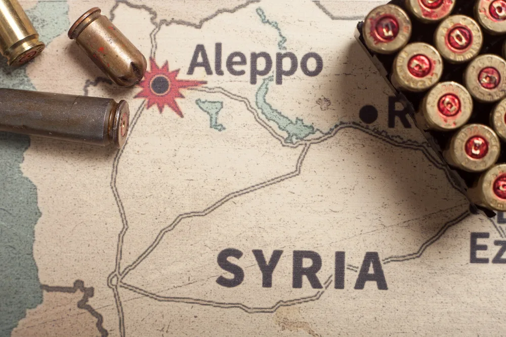 Concept of Syrian conflict with bullets placed on a map of the country for an article exploring is Syria safe to visit?
