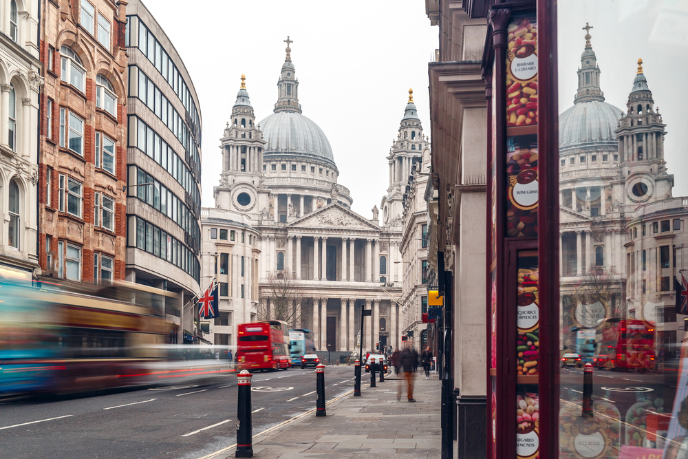 St. Paul's Cathedral in the winter pictured on a gloomy day with a bus driving by in a blurry, long exposure image