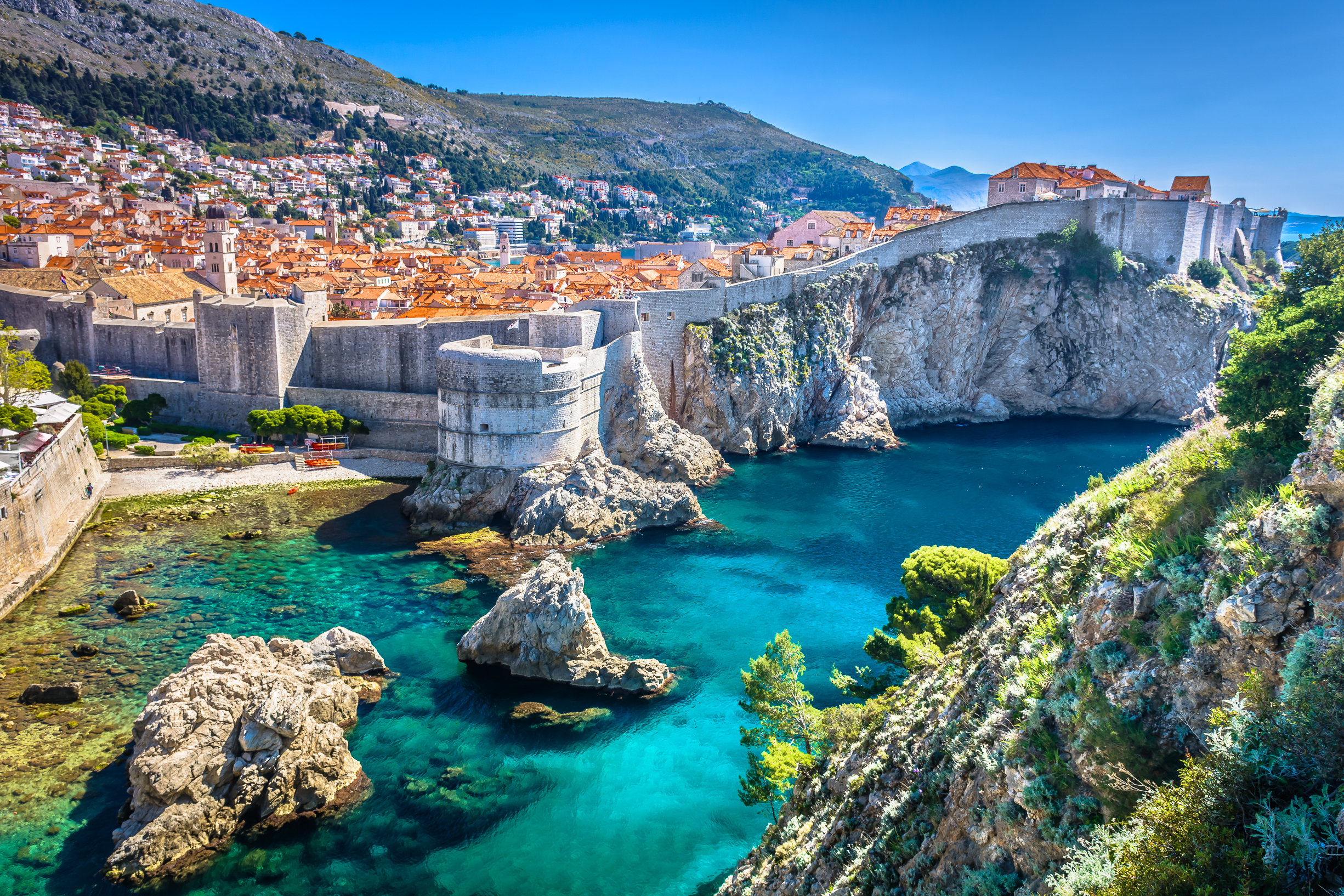 Aerial view of rock formations and stone bridge in Dubrovnik, Croatia which is one of the cheapest places to visit in Europe