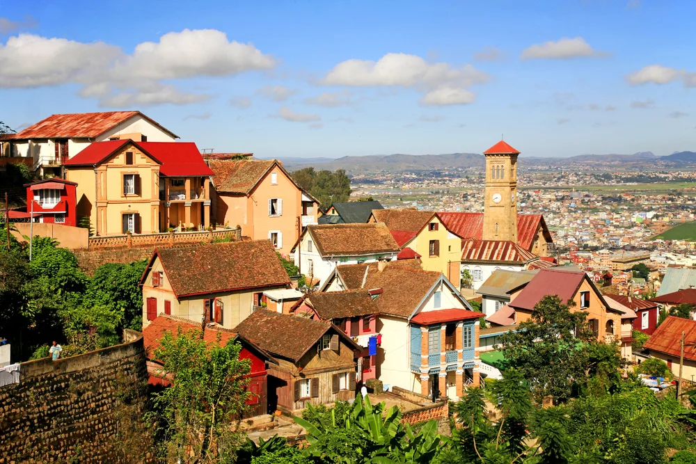 Old houses built closely together in a higher altitude at Antananarivo, one of the best areas to stay in Madagascar, a populated area can be seen on the plains of the town