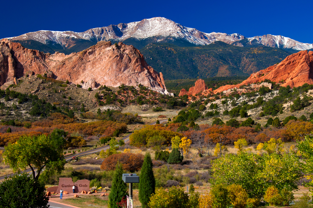 Photo of Garden of the Gods pictured in the afternoon on a clear day with Pike's Peak in the background for a guide to the best places to stay in Colorado