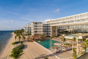 Pool deck and beachfront aerial photo at Sensira Resort in Mexico