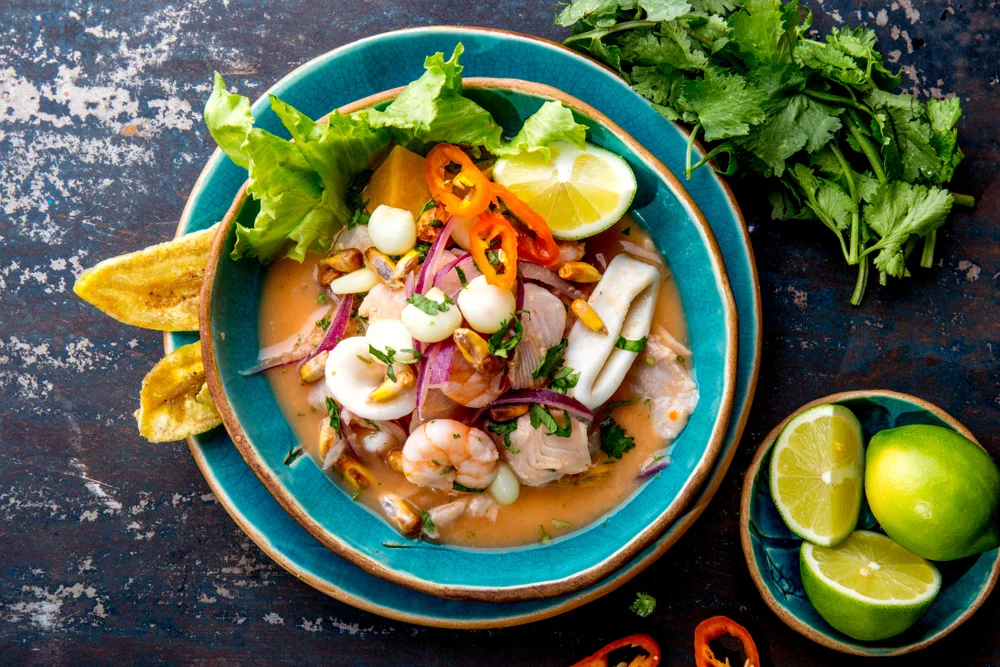 A local dish mixed called Ceviche with seafood, vegetables, spices, and lemon prepared on a plate, the origin of this famous dish in Ecuador, a known fact to food lovers.