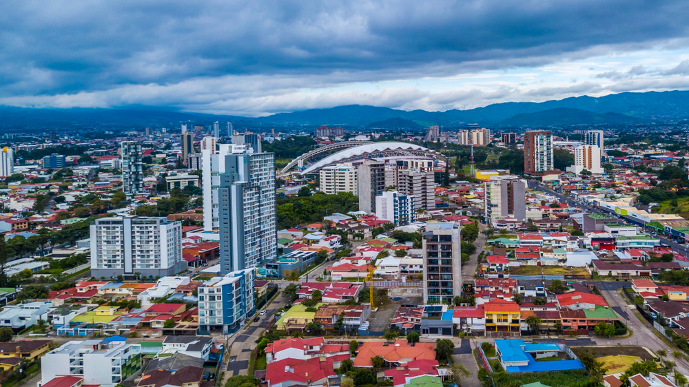 Aerial view of the colorful cityscape of San Jose, Costa Rica for a guide answering how long is a flight to Costa Rica from cities in the US?