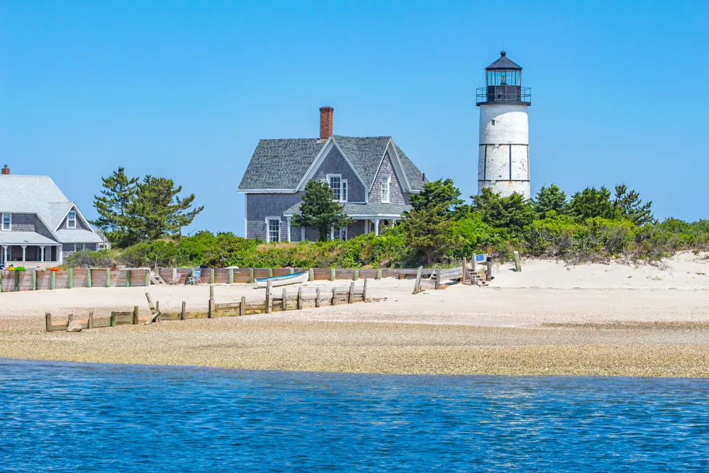 Concept of one of the best weekend trips in the US of the Northeast with Sandy Neck Lighthouse in Cape Cod, MA on a clear day