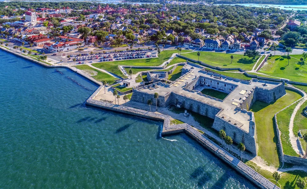 Aerial view of the Castillo de San Marcos fortress in St. Augustine for an article describing how long is a flight to Florida from the West Coast