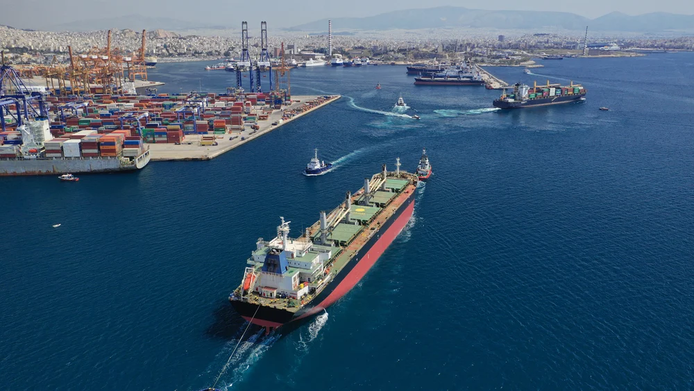 Aerial view of a port where large ships loaded with tons of cargo, a concept image for an item on the list of facts about Greece.