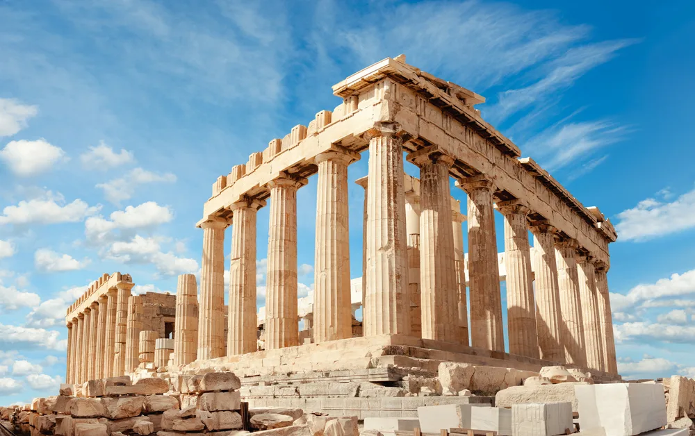 The famous Parthenon ruins in Greece photographed during a partly cloudy afternoon, it was believed that the marbles in the ruins were stolen by the English, one item on the list of facts about Greece.