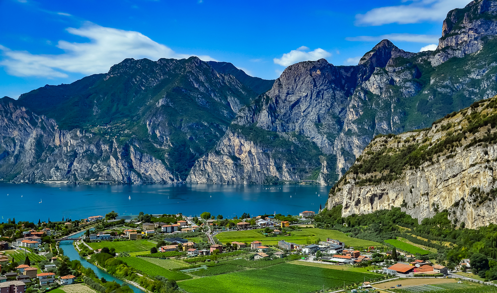 A small town on the plains in Riva del Garda, one of the best areas to stay in the Italian Lakes, facing a mountainous area on the other side of the lake.